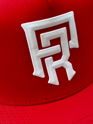 Red Zapped Headwear hat with a white domed Flexstyle PR monogram emblem